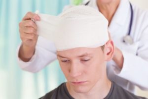 Man with head bandage