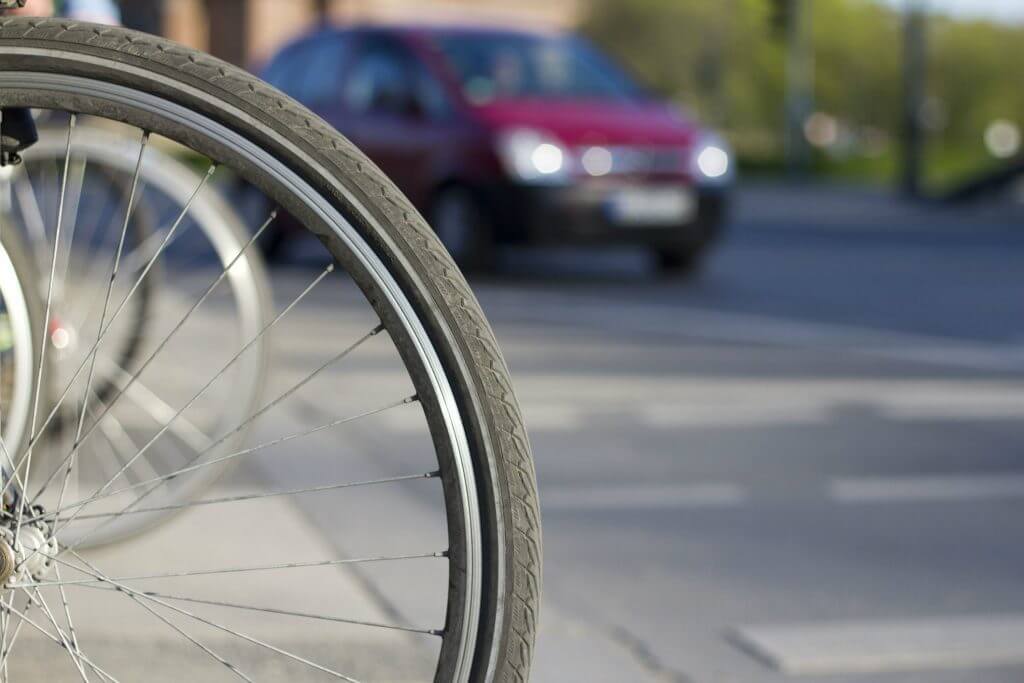 Bicycle pulling in front of car