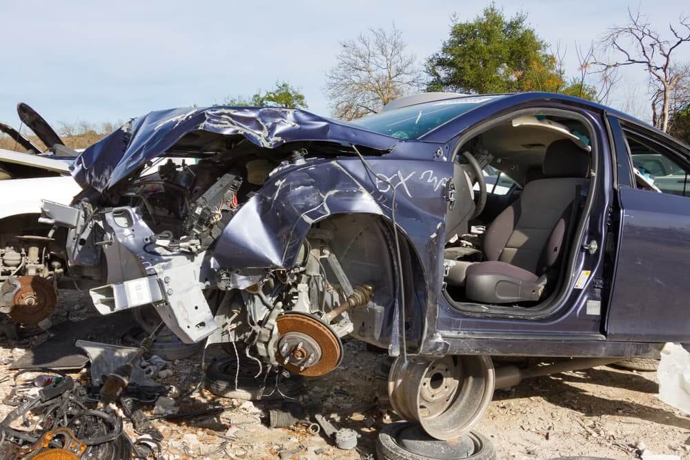 Dark blue car involved in a head-on collision in Austin, Texas.