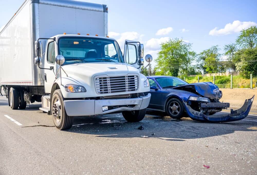 Truck collides with a car