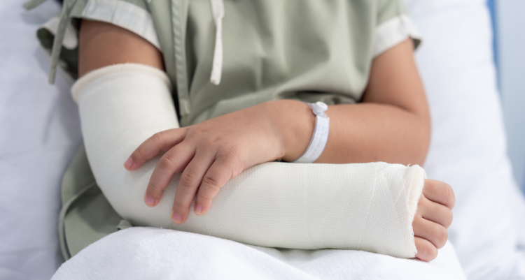 A child in the hospital, injured from a car wreck.