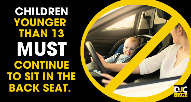 An image of a woman and child sitting in the front seat of a car, crossed out in yellow, indicating that children under 13 must sit in the back seat.