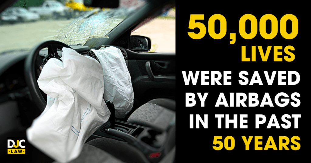 A car interior featuring an air bag on the steering wheel, highlighting the message about airbags saving 50,000 lives in 50 years.